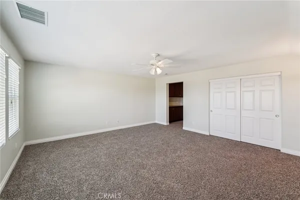an empty room with a empty space and a window