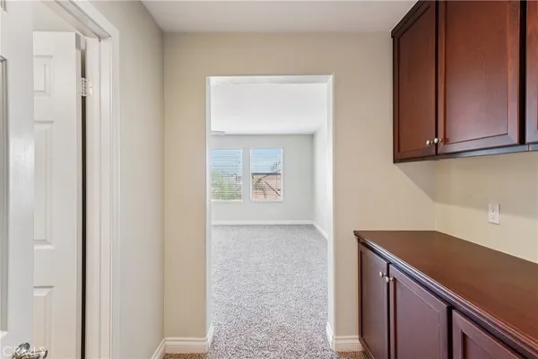 a view of a kitchen cabinets and a wooden floor