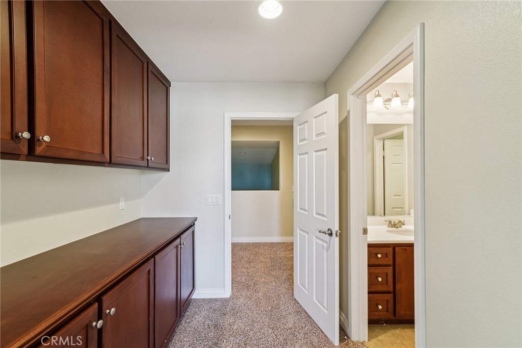 28552 Rustic Glen Street Menifee, CA 92584 - Photo 28 of 48 Versatile upstairs suite with bathroom and extra storage space
