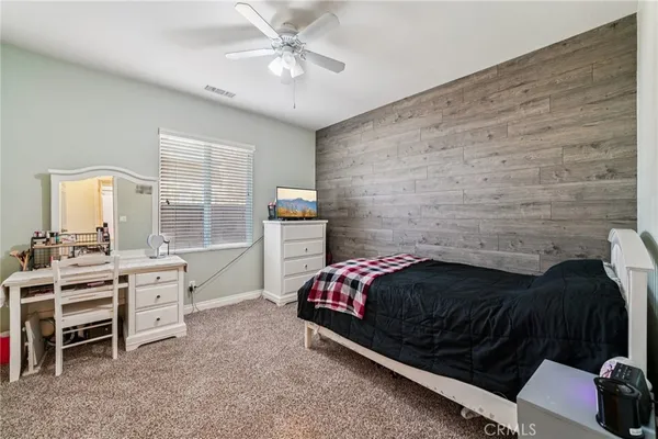 a bedroom with a bed and a cabinets