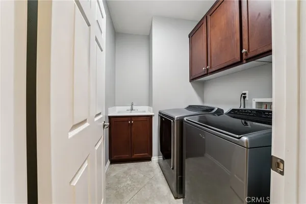 a kitchen with a refrigerator and cabinets