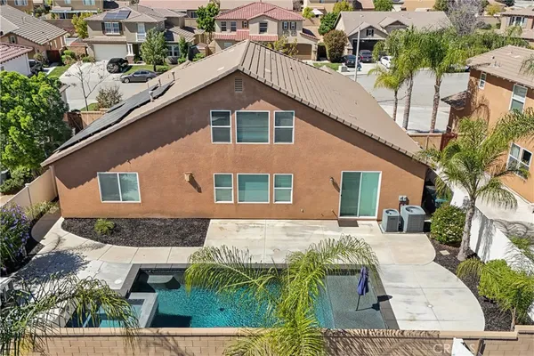an aerial view of a house with a yard
