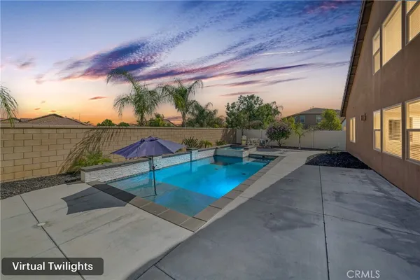 a view of swimming pool with outdoor seating