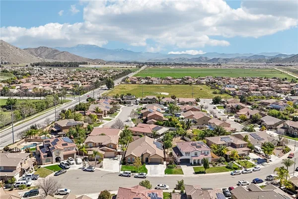 an aerial view of residential houses with outdoor space
