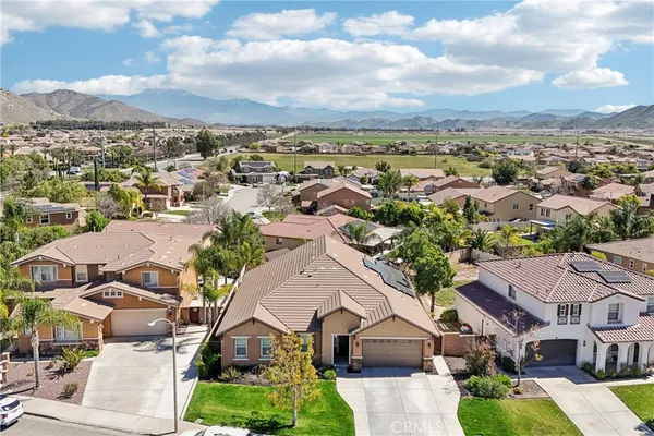 an aerial view of residential houses and street