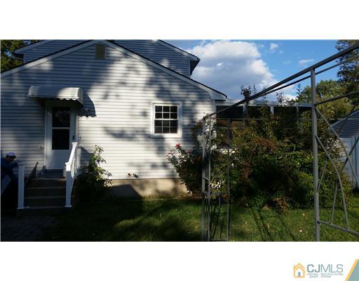 626 Spruce Road North Brunswick, NJ 08902 - Photo 2 of 23 a black and white photo of a house
