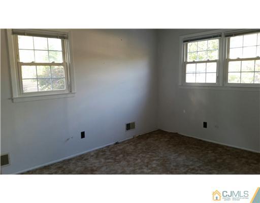 626 Spruce Road North Brunswick, NJ 08902 - Photo 17 of 23 a room with a window and a projector