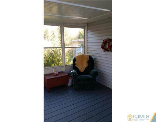 626 Spruce Road North Brunswick, NJ 08902 - Photo 20 of 23 a living room with furniture and a window