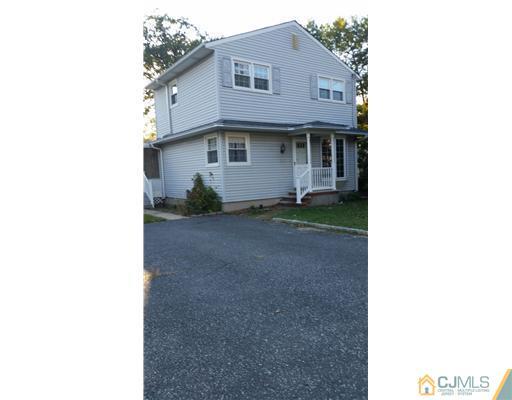 626 Spruce Road North Brunswick, NJ 08902 - Photo 22 of 23 a front view of a house with a yard