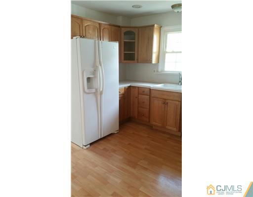 626 Spruce Road North Brunswick, NJ 08902 - Photo 4 of 23 a kitchen with stainless steel appliances granite countertop a refrigerator and a sink