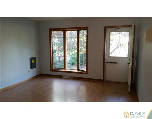 626 Spruce Road North Brunswick, NJ 08902 - Photo 5 of 23 a open hall with a lake view and window