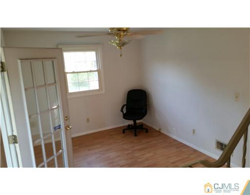 626 Spruce Road North Brunswick, NJ 08902 - Photo 6 of 23 a black and white photo of a living room