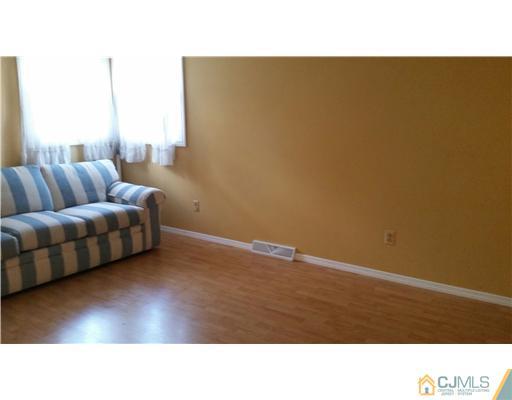 626 Spruce Road North Brunswick, NJ 08902 - Photo 7 of 23 a kitchen with a sink and a couch