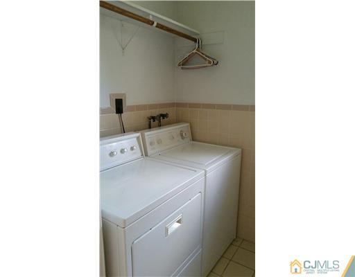 626 Spruce Road North Brunswick, NJ 08902 - Photo 9 of 23 a utility room with dryer and washer
