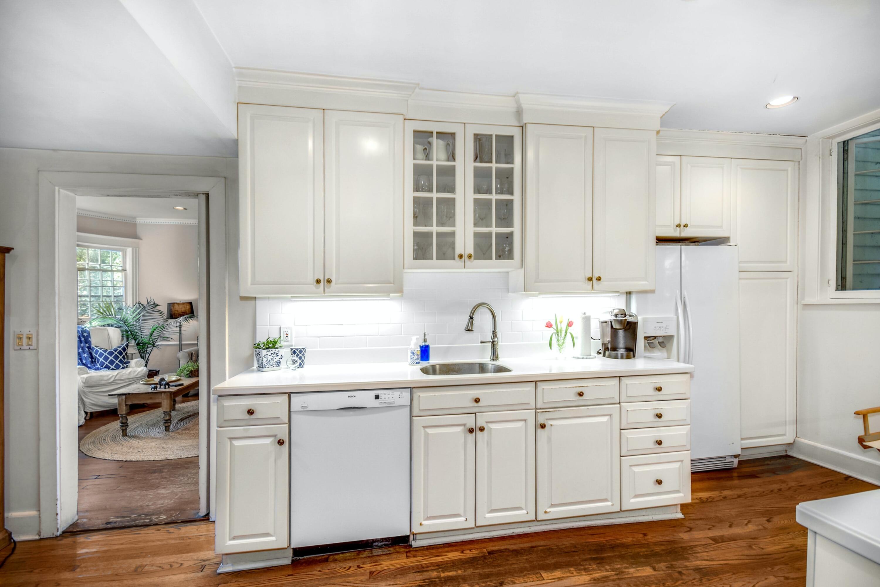 162 Marshall Ridge Road New Canaan, CT 06840 - Photo 13 of 29 a kitchen with a sink cabinets and wooden floor