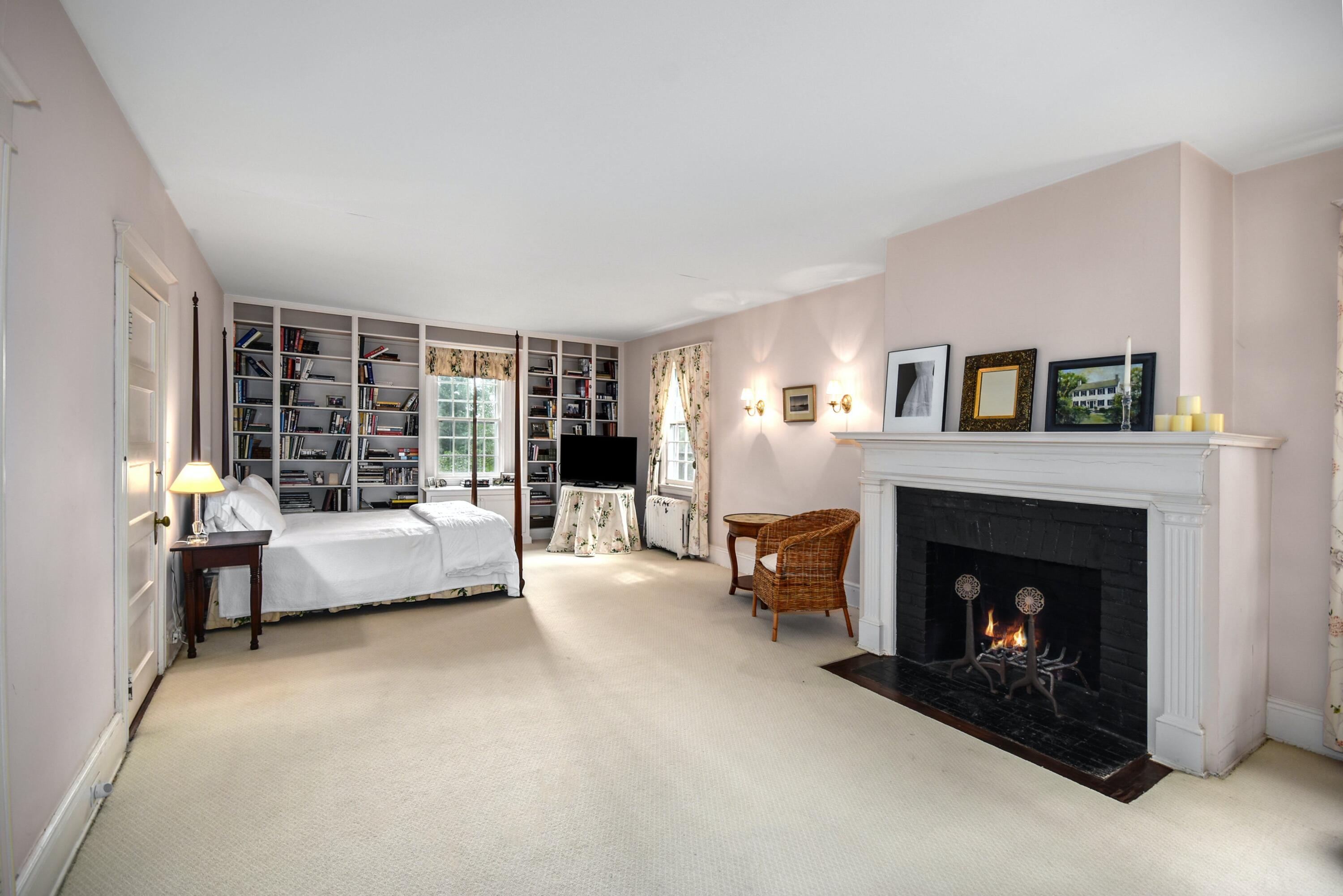 162 Marshall Ridge Road New Canaan, CT 06840 - Photo 20 of 29 a living room with furniture and a fireplace