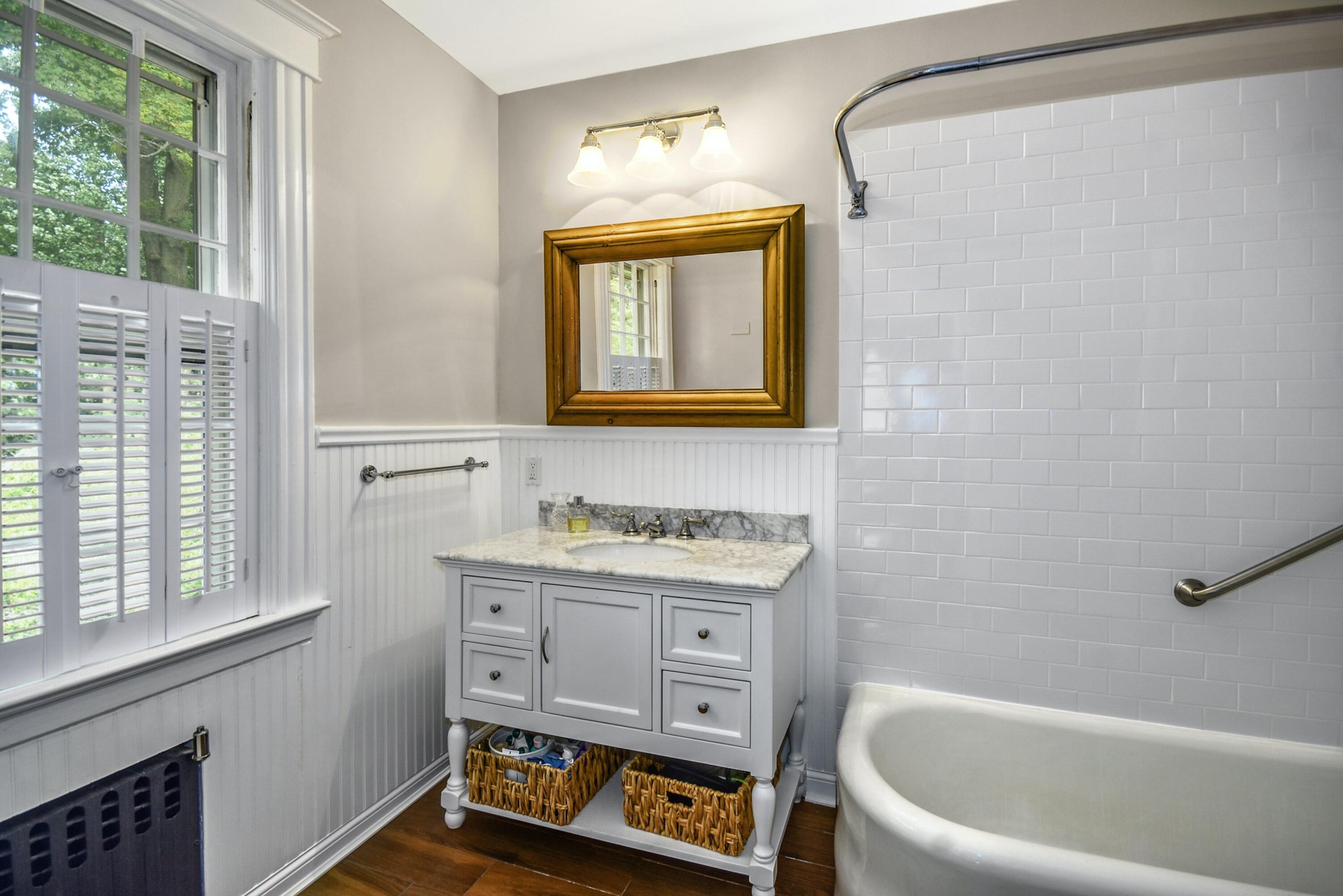 162 Marshall Ridge Road New Canaan, CT 06840 - Photo 21 of 29 a bathroom with a tub sink and mirror