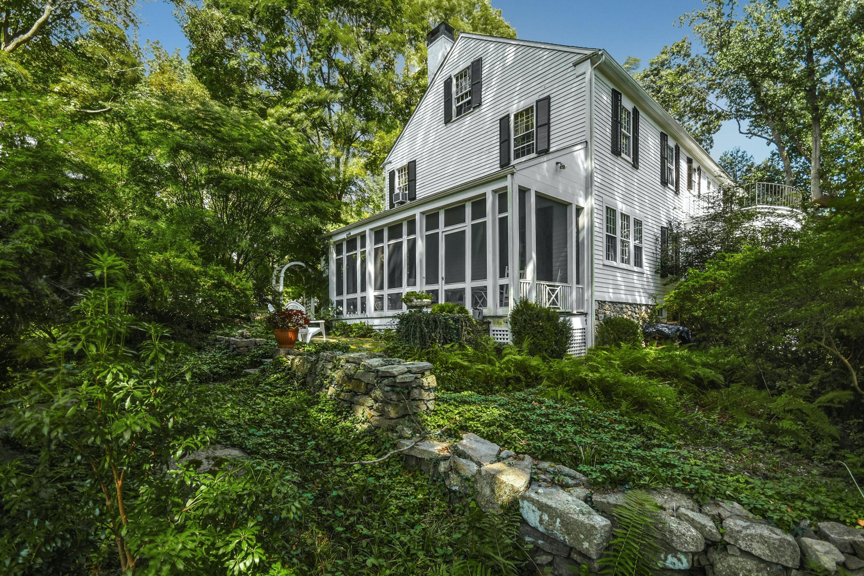 162 Marshall Ridge Road New Canaan, CT 06840 - Photo 25 of 29 a view of a house with a yard and plants