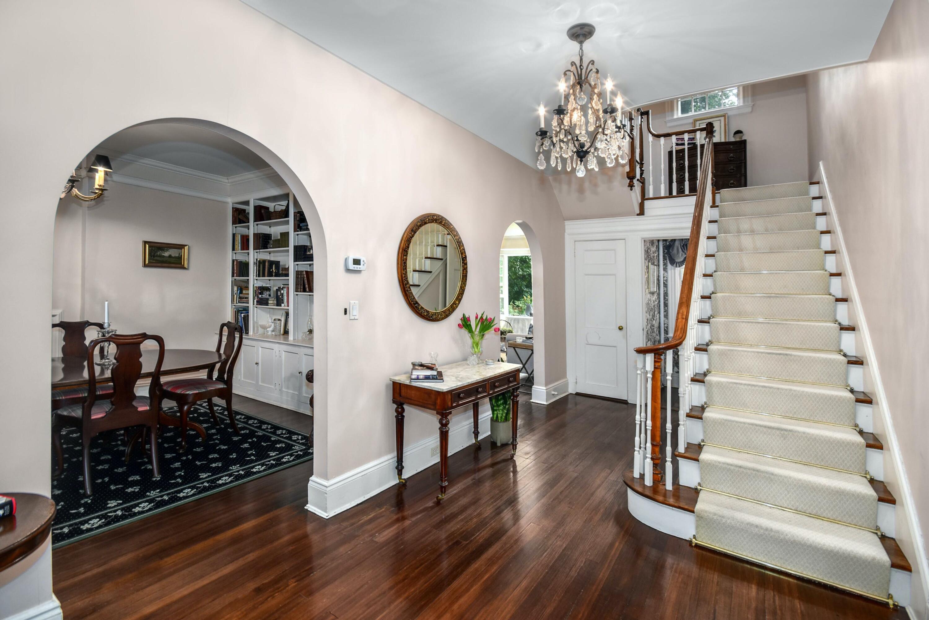 162 Marshall Ridge Road New Canaan, CT 06840 - Photo 4 of 29 a living room with furniture and a chandelier