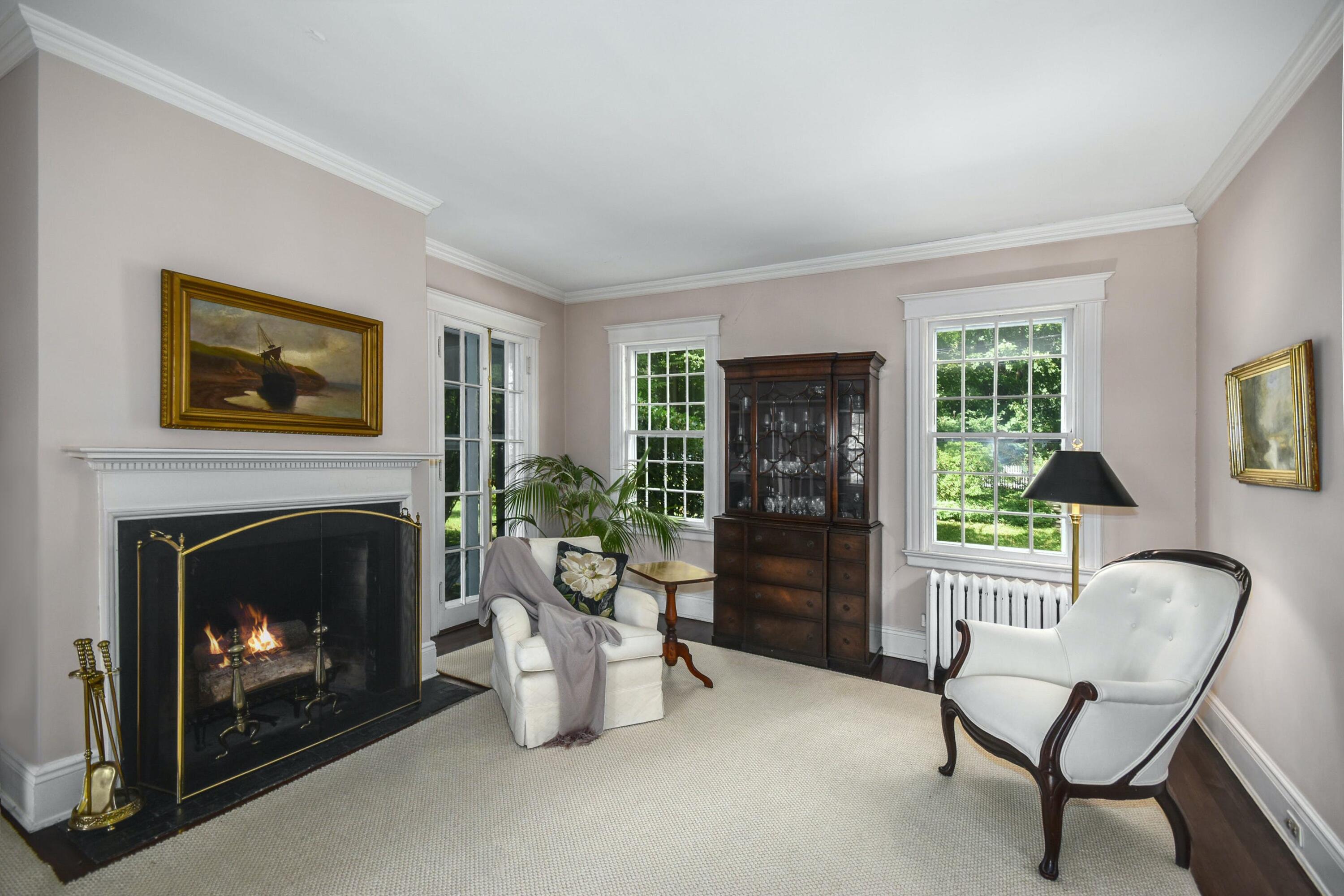 162 Marshall Ridge Road New Canaan, CT 06840 - Photo 8 of 29 a living room with furniture and a fireplace