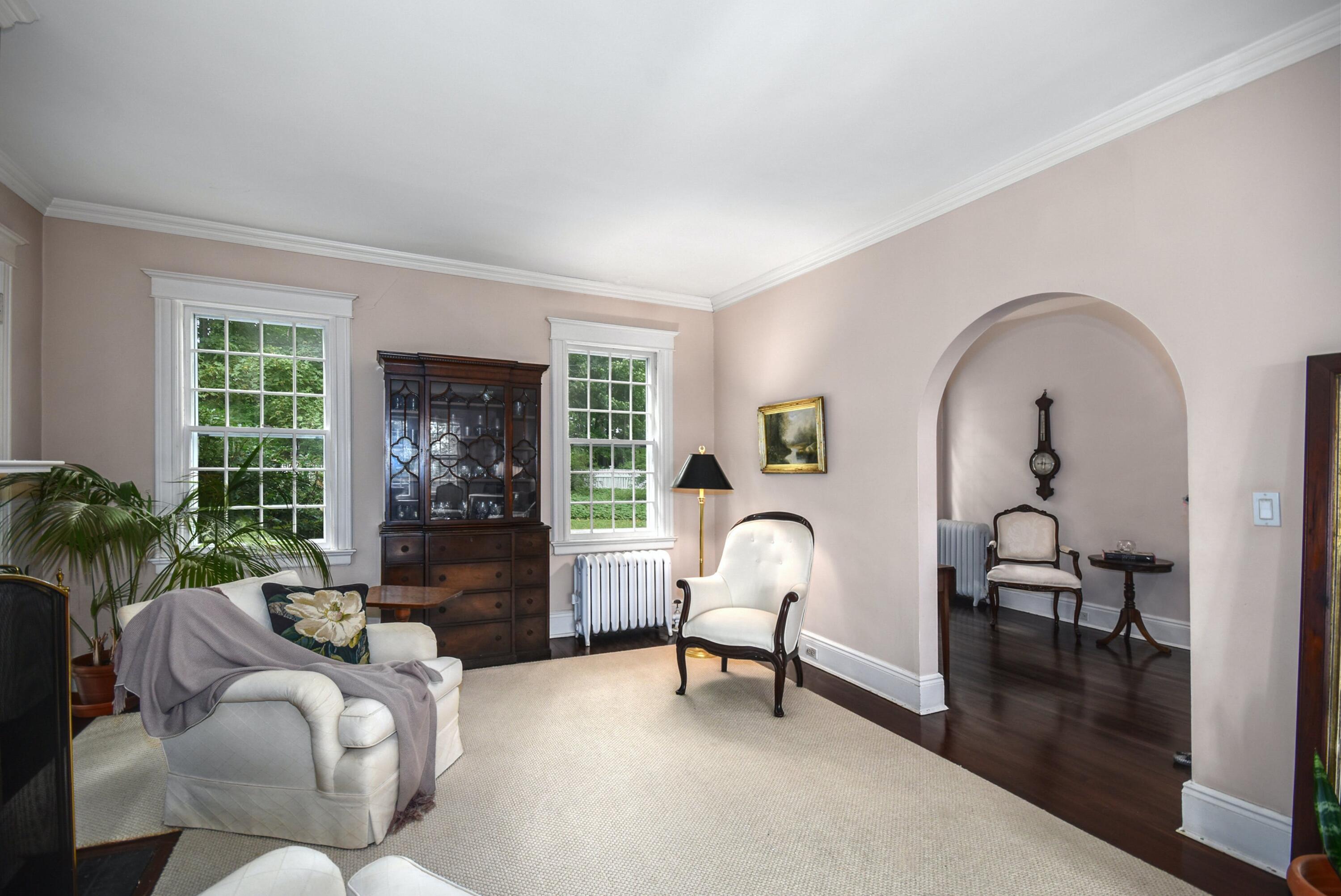 162 Marshall Ridge Road New Canaan, CT 06840 - Photo 9 of 29 a living room with furniture a rug a window and a fireplace