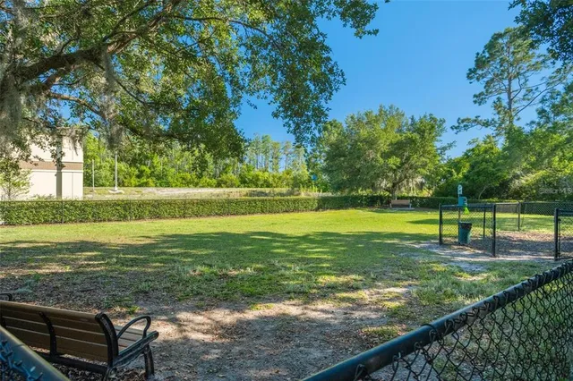 a view of a swimming pool with a sitting area