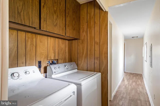 a view of bathroom with washer and dryer