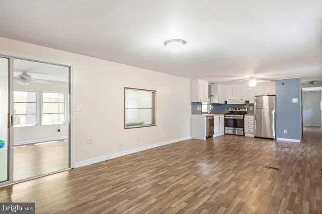 a view of kitchen with wooden floor