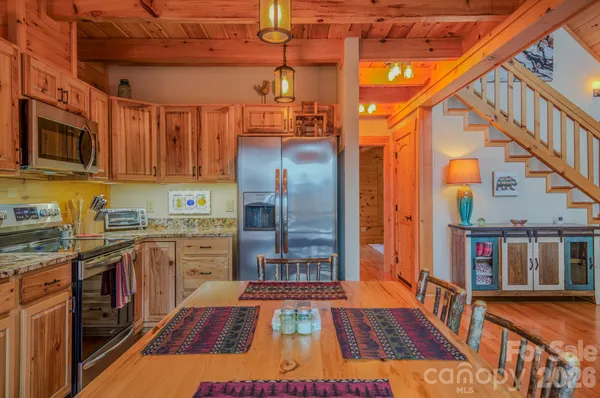 a bedroom with furniture and a flat screen tv