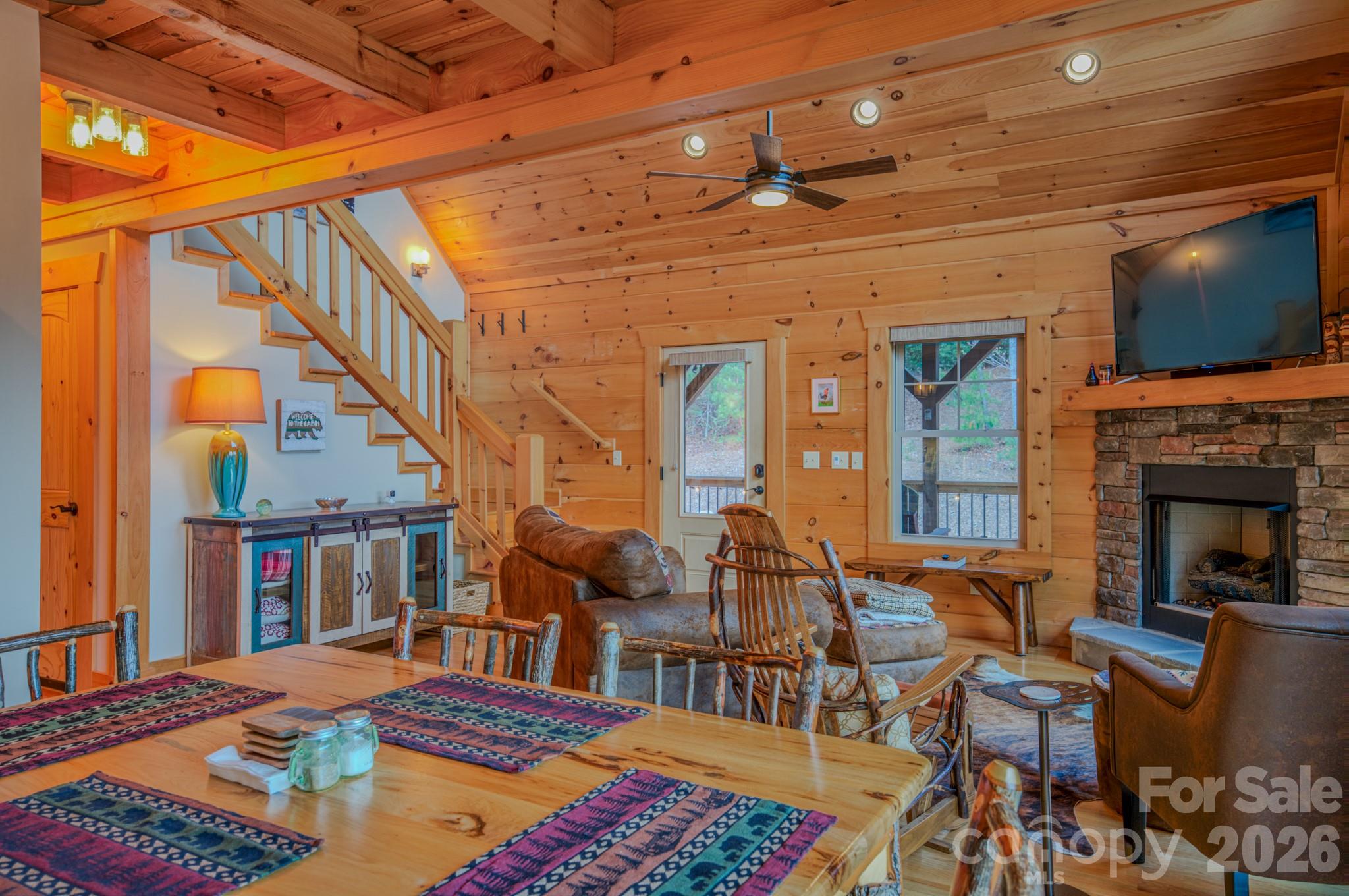 9147 Shortoff View Terrace Nebo, NC 28761 - Photo 12 of 48 a bedroom with furniture and a flat screen tv