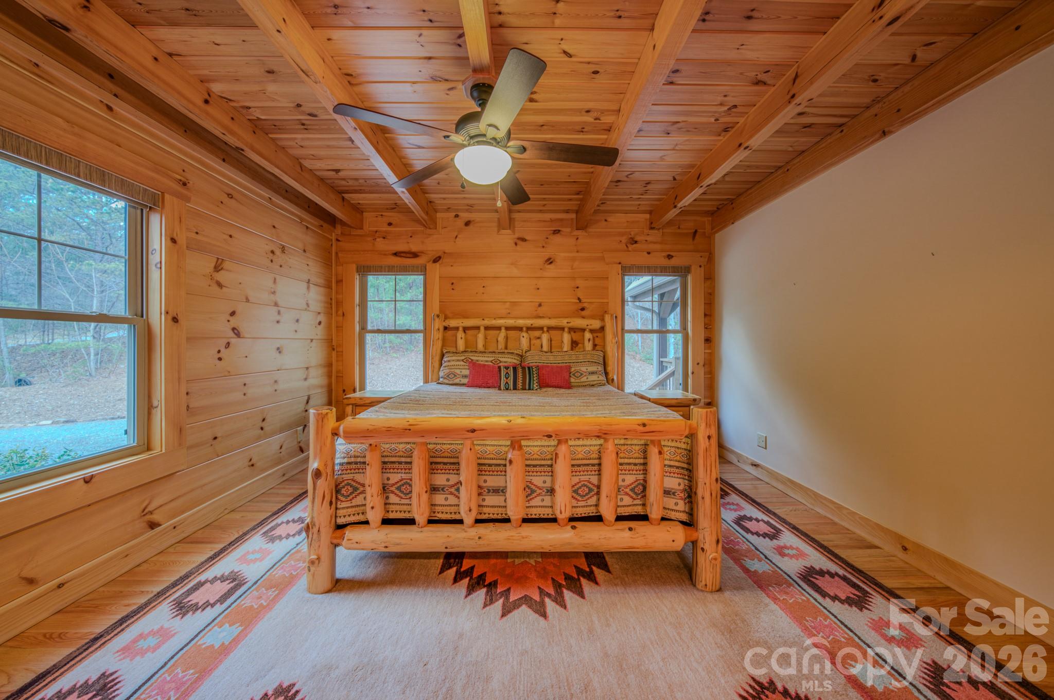 9147 Shortoff View Terrace Nebo, NC 28761 - Photo 15 of 48 a large bed sitting in a room next to a window