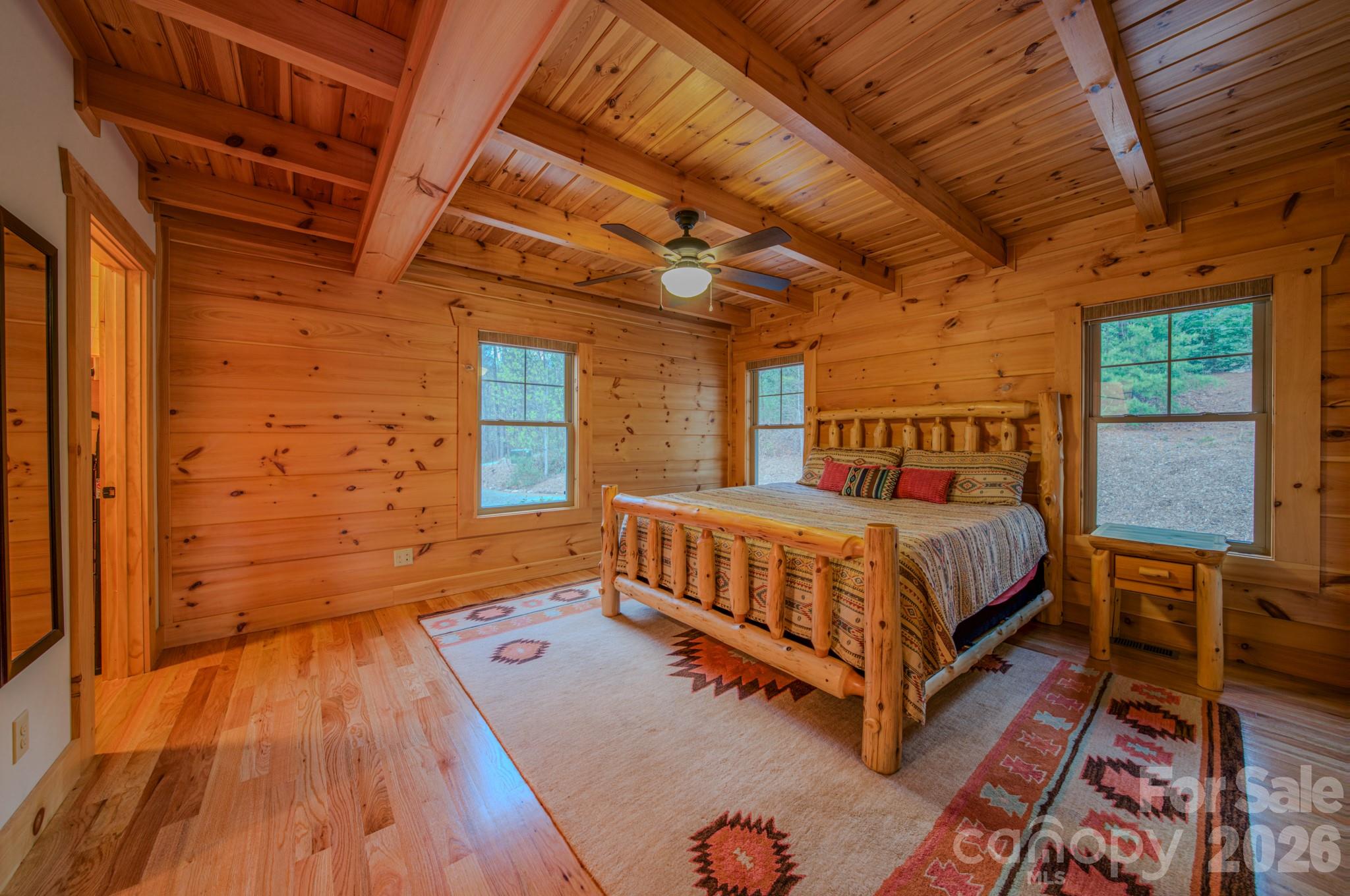 9147 Shortoff View Terrace Nebo, NC 28761 - Photo 16 of 48 a bed sitting in a bedroom next to a window