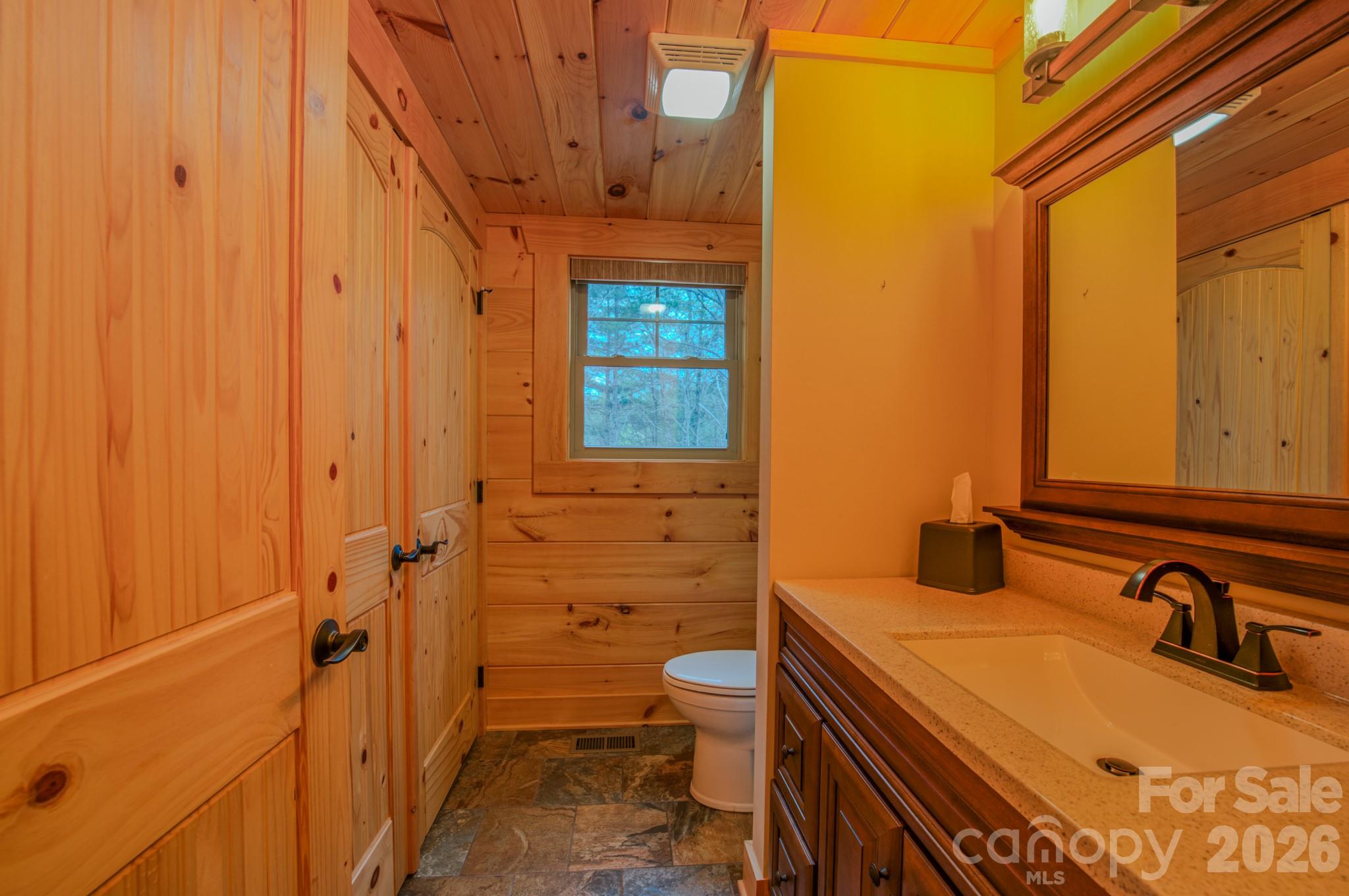 9147 Shortoff View Terrace Nebo, NC 28761 - Photo 17 of 48 a bathroom with a sink a toilet and shower