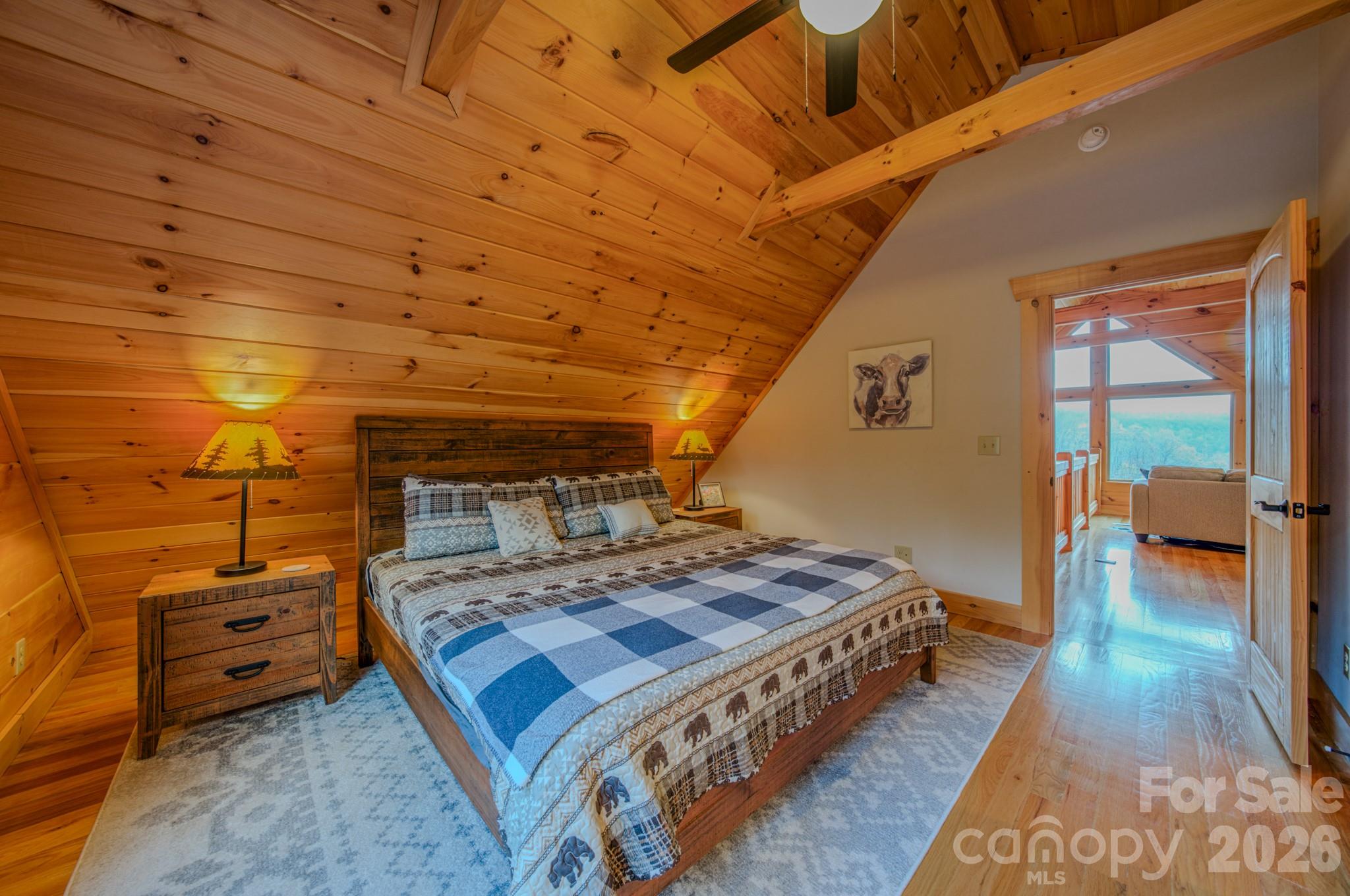 9147 Shortoff View Terrace Nebo, NC 28761 - Photo 21 of 48 a bedroom with a bed and a mirror