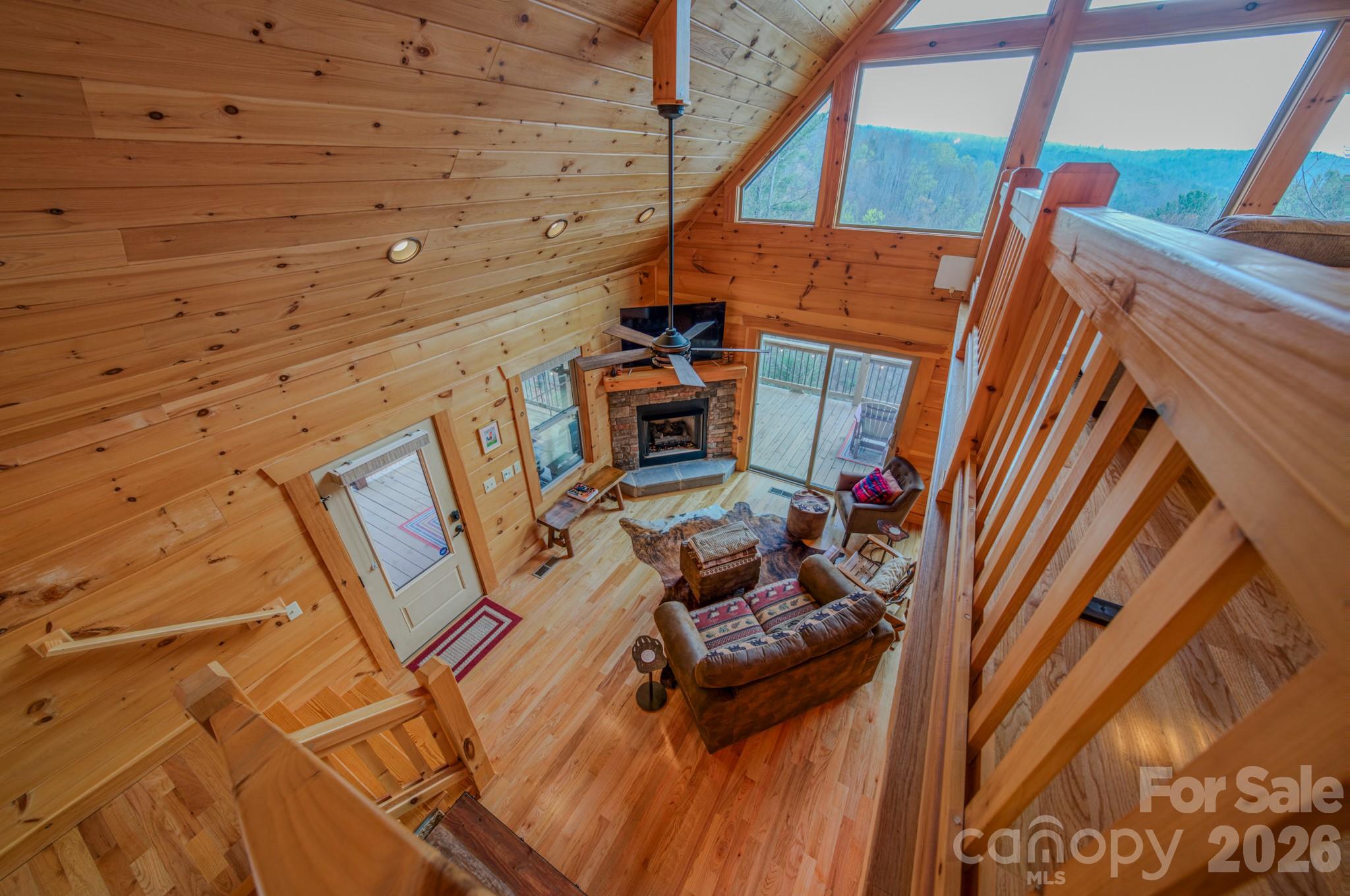 9147 Shortoff View Terrace Nebo, NC 28761 - Photo 27 of 48 a living room with furniture and a fireplace