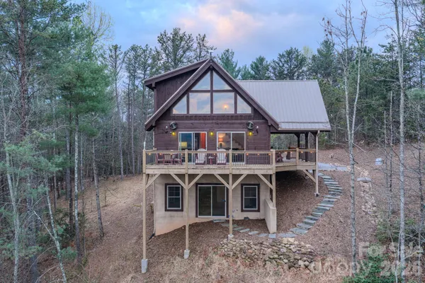 an aerial view of a house with mountain view