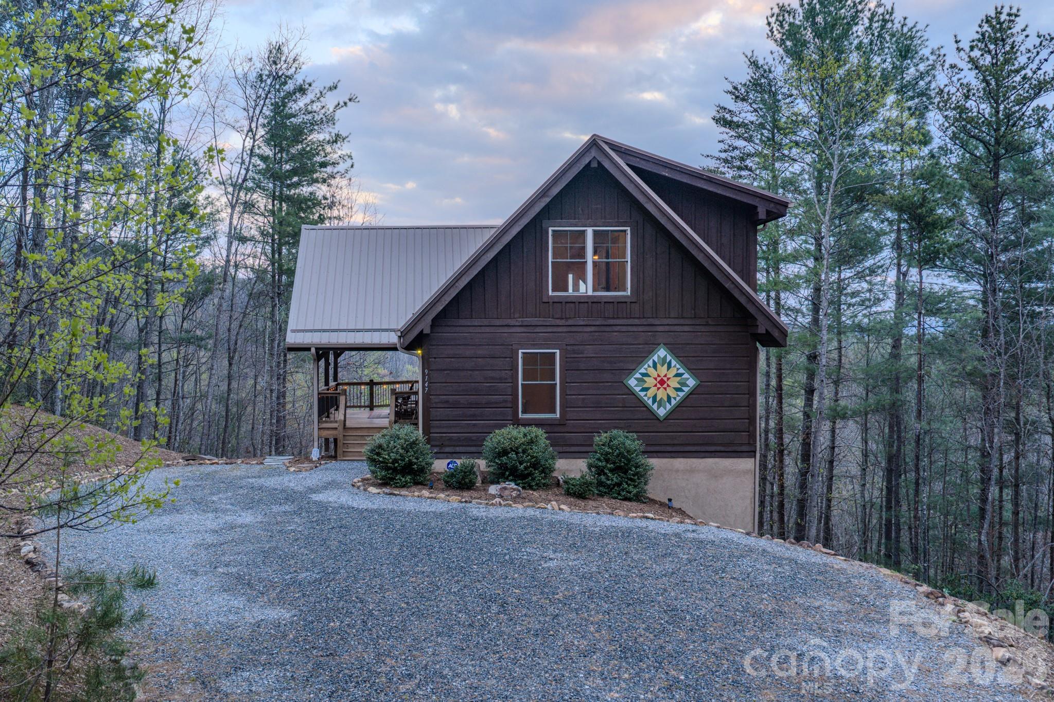 9147 Shortoff View Terrace Nebo, NC 28761 - Photo 35 of 48 a view of a house with yard and a trees