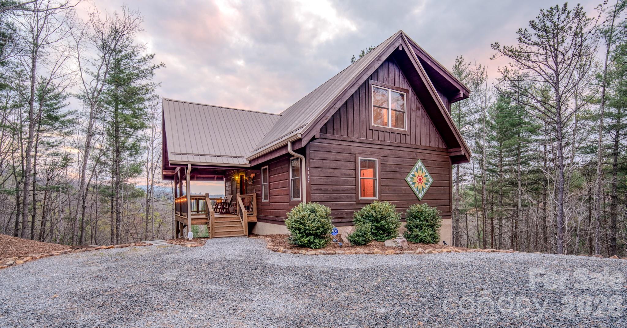 9147 Shortoff View Terrace Nebo, NC 28761 - Photo 4 of 48 a front view of a house with garden