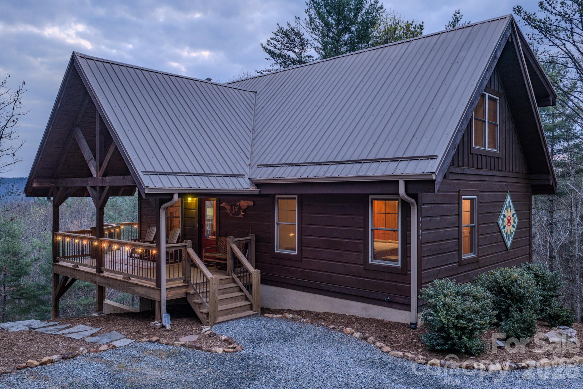9147 Shortoff View Terrace Nebo, NC 28761 - Photo 5 of 48 a view of a patio with table and chairs