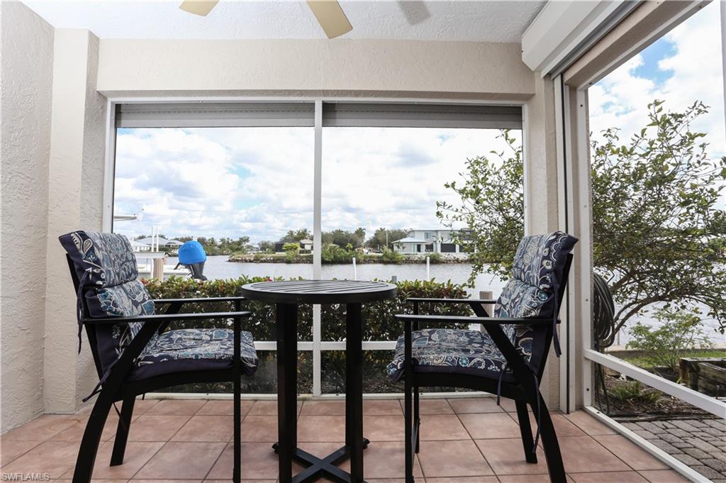 162 Eveningstar Cay Naples, FL 34114 - Photo 13 of 32 a view of a balcony with chairs