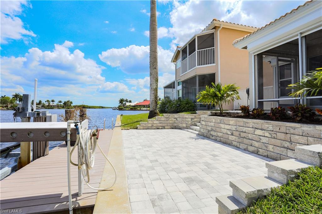 162 Eveningstar Cay Naples, FL 34114 - Photo 20 of 32 a view of a patio with swimming pool