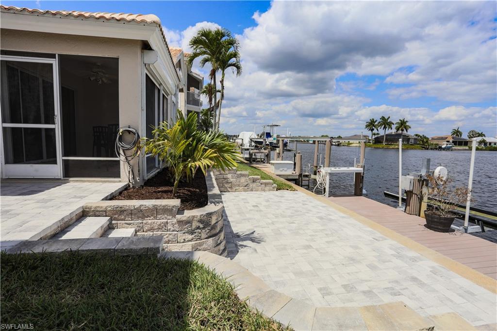 162 Eveningstar Cay Naples, FL 34114 - Photo 22 of 32 a view of a backyard with sitting area