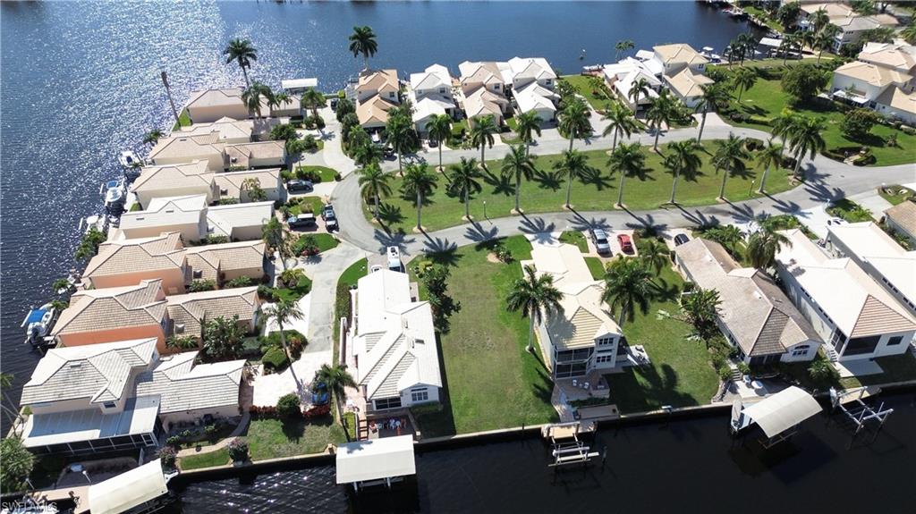 162 Eveningstar Cay Naples, FL 34114 - Photo 28 of 32 an aerial view of a residential houses with outdoor space and street view