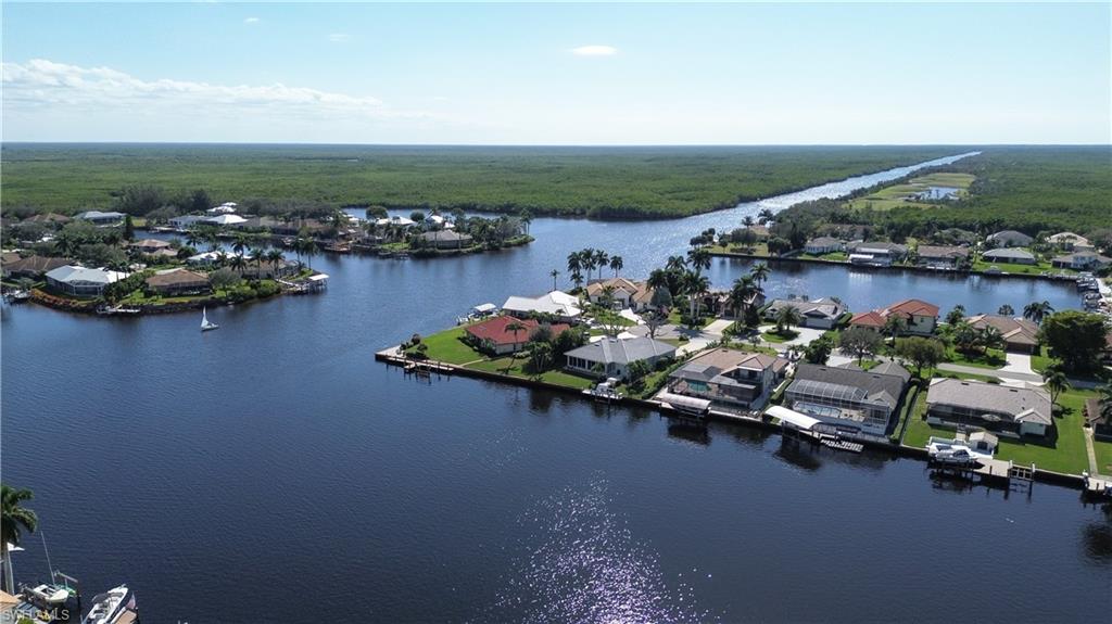 162 Eveningstar Cay Naples, FL 34114 - Photo 29 of 32 an aerial view of a houses with ocean view