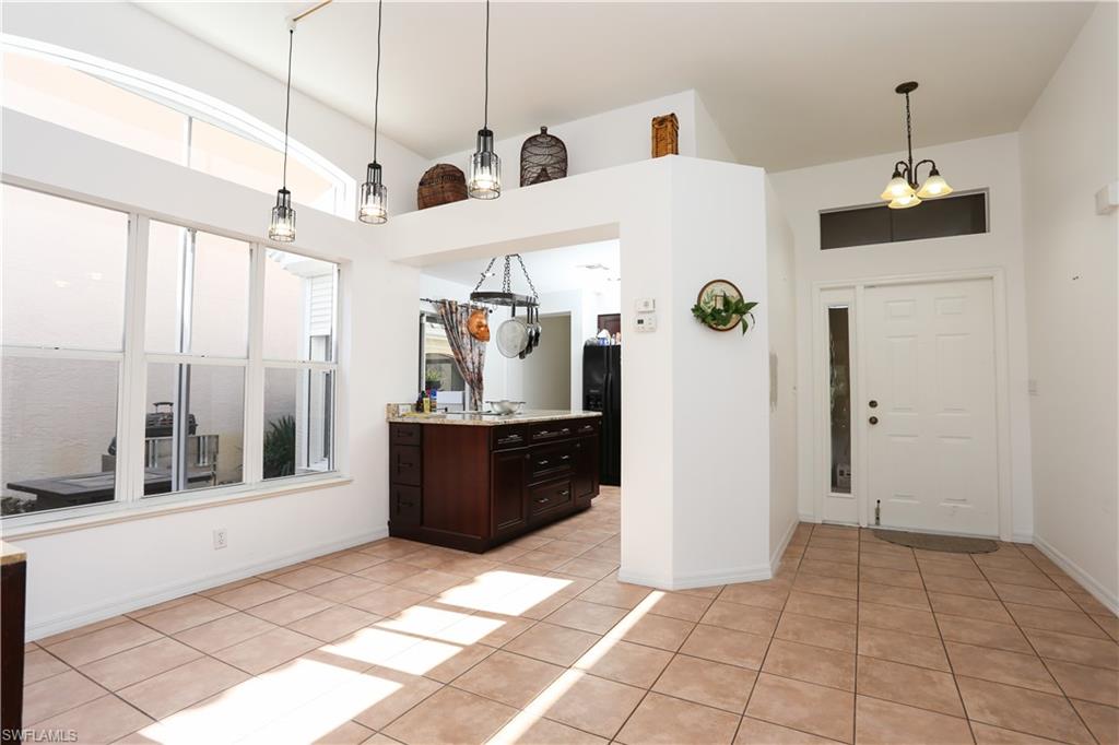 162 Eveningstar Cay Naples, FL 34114 - Photo 7 of 32 a very nice looking room with windows