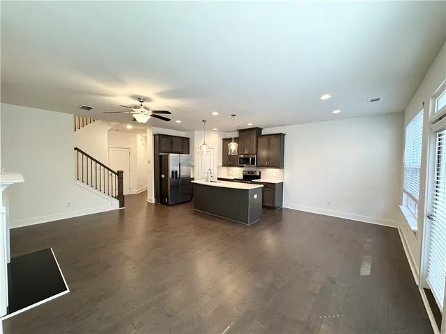 a view of kitchen with cabinets and wooden floor