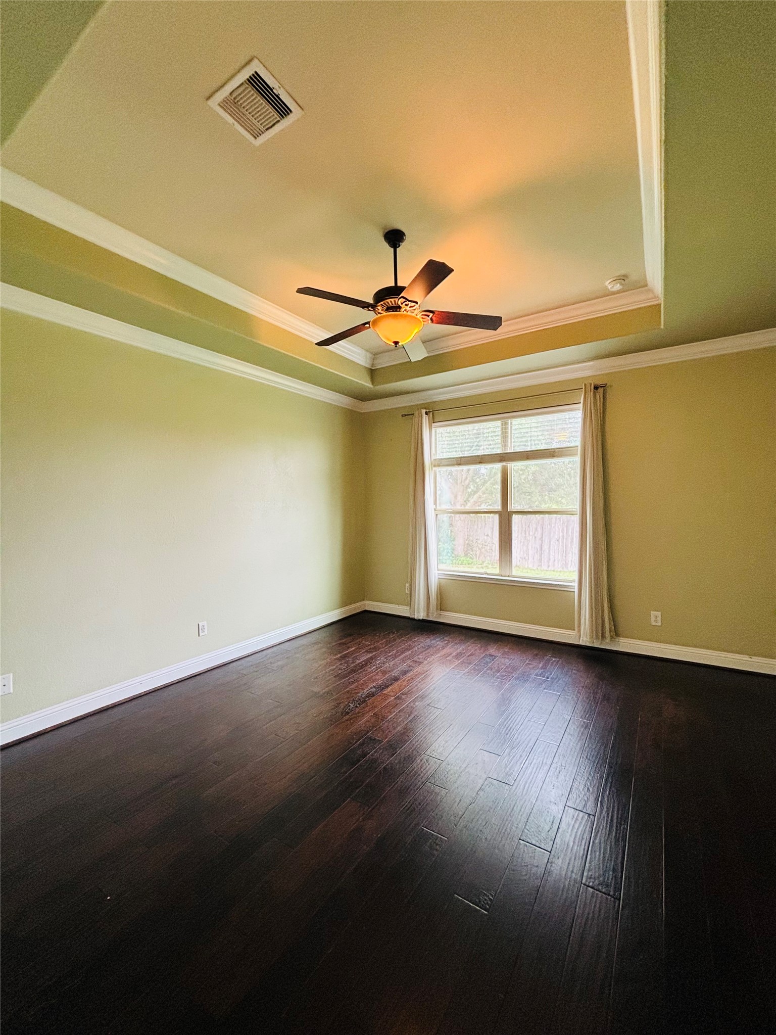 419 Blossom Terrace Lane Rosenberg, TX 77469 - Photo 13 of 19 an empty room with wooden floor and windows
