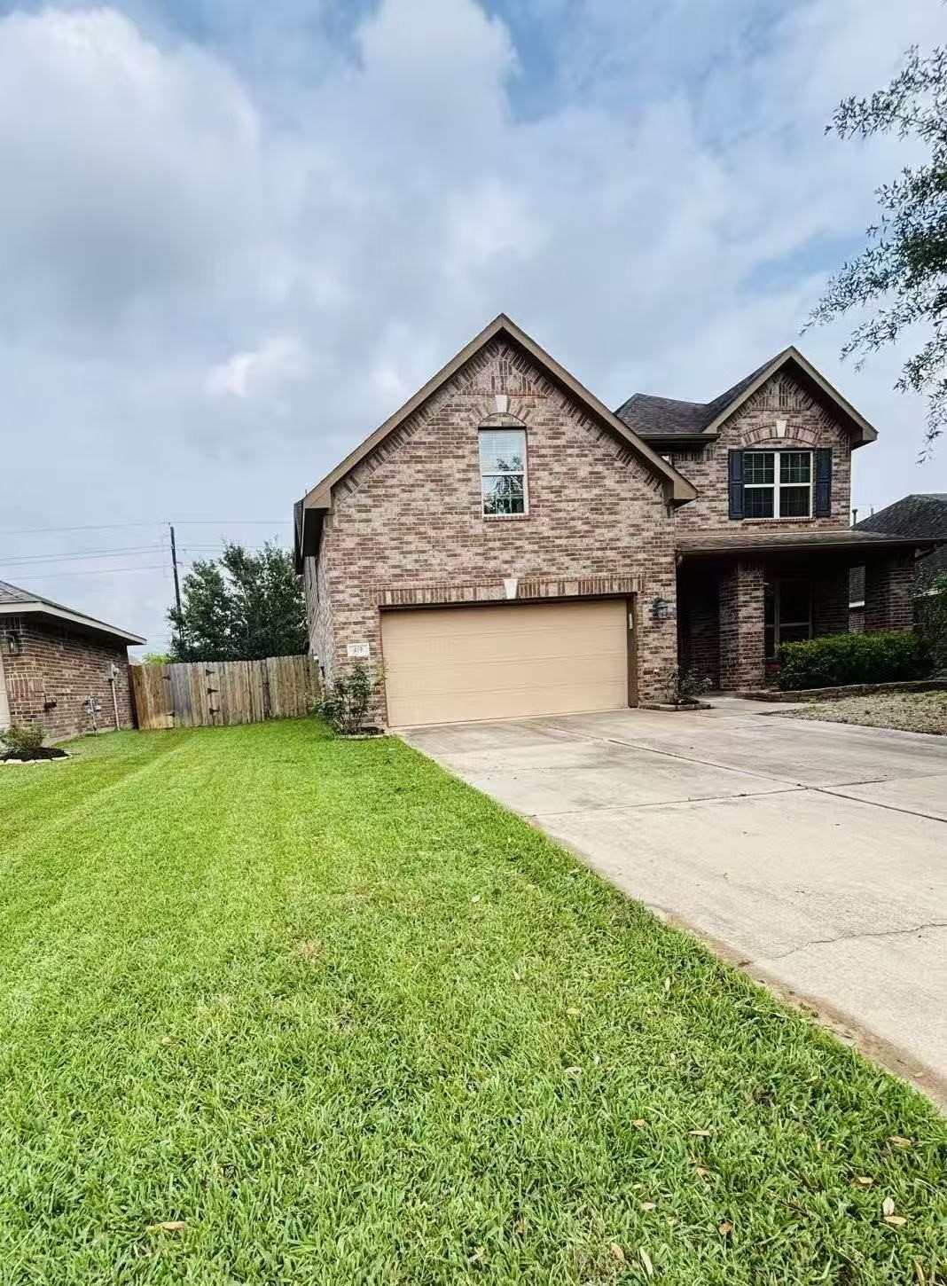 419 Blossom Terrace Lane Rosenberg, TX 77469 - Photo 19 of 19 a front view of a house with a yard and garage