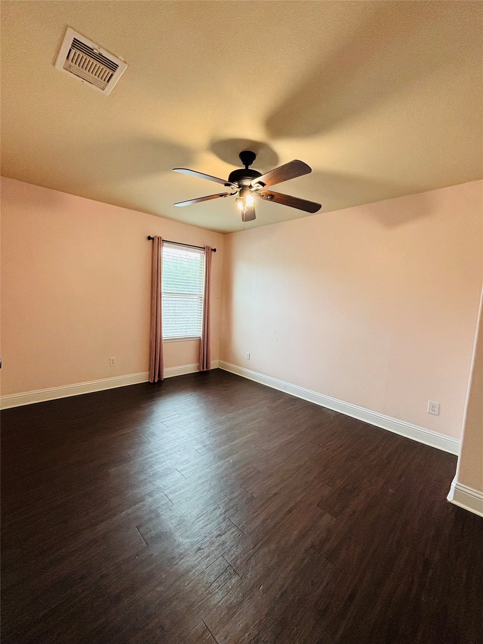 419 Blossom Terrace Lane Rosenberg, TX 77469 - Photo 10 of 19 an empty room with wooden floor fan and windows