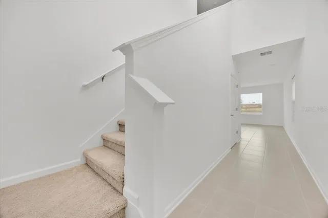 a view of a hallway view with staircase